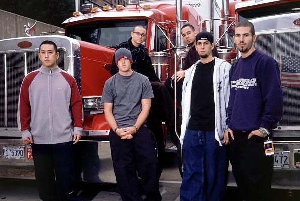 linkin Park's original line up standing in front of a truck